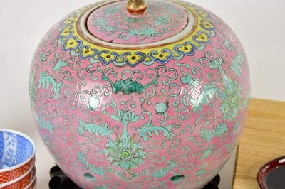Lot 1367 - A Chinese Famille Rose bulbous jar and cover...