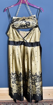 Lot 840 - TED BAKER; a gold and black 100% silk midi...