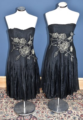 Lot 855 - COAST; two black cotton and silk short length...