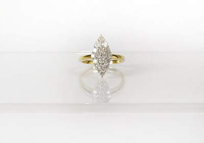 Lot 765 - A 9ct yellow gold ring set with diamonds in a...