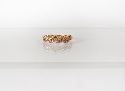 Lot 759 - A 9ct rose gold ring set with tiny diamonds in...