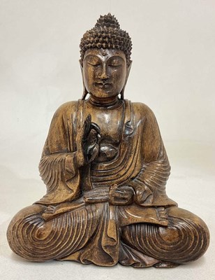 Lot 21 - A wooden seated Buddha, height 32cm.