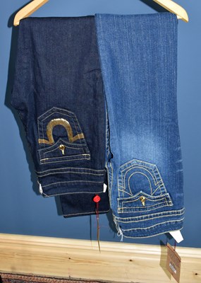 Lot 844 - TRUE RELIGION; two pairs of jeans, unworn with...