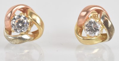 Lot 1421 - A pair of 9ct three colour gold ear studs,...