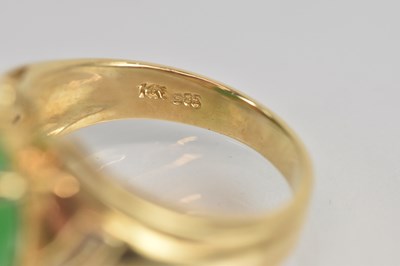 Lot 1335 - A 14ct yellow gold oval cabochon jade set ring...