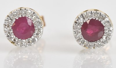 Lot 1418 - A pair of 9ct yellow and white gold ruby and...