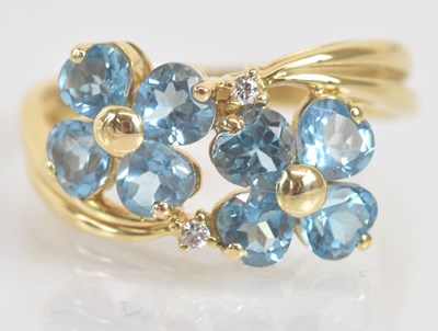 Lot 1278 - An 18ct yellow gold blue topaz and twin...