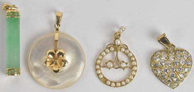 Lot 1455 - Two 14ct yellow gold mounted pendants, one set...