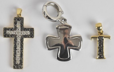 Lot 1453 - Three 9ct yellow and white gold cross pendants,...