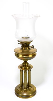 Lot 263 - A four column brass oil lamp, with frosted...