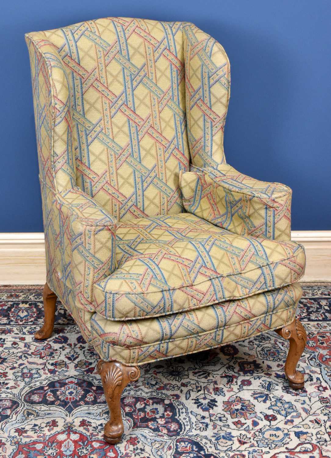 Lot 2810 - A walnut upholstered wingback arm chair,...