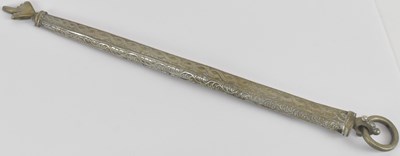 Lot 1119 - An Eastern white metal Torah guide, with loop...