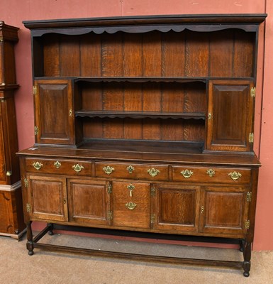 Lot 2949 - A 1920's oak dresser and plate rack with three...