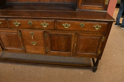 Lot 2949 - A 1920's oak dresser and plate rack with three...