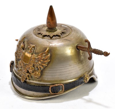 Lot 320 - A minature pickelhaube helmet, height 7cm.