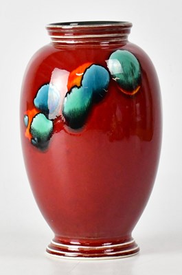 Lot 234 - POOLE POTTERY; a red ground baluster vase,...