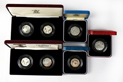 Lot 614 - Seven commemorative silver proof 50p coins,...