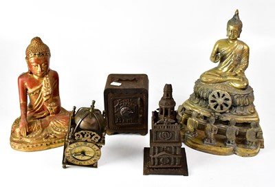 Lot 328 - A cast metal figure of a seated Buddha with...