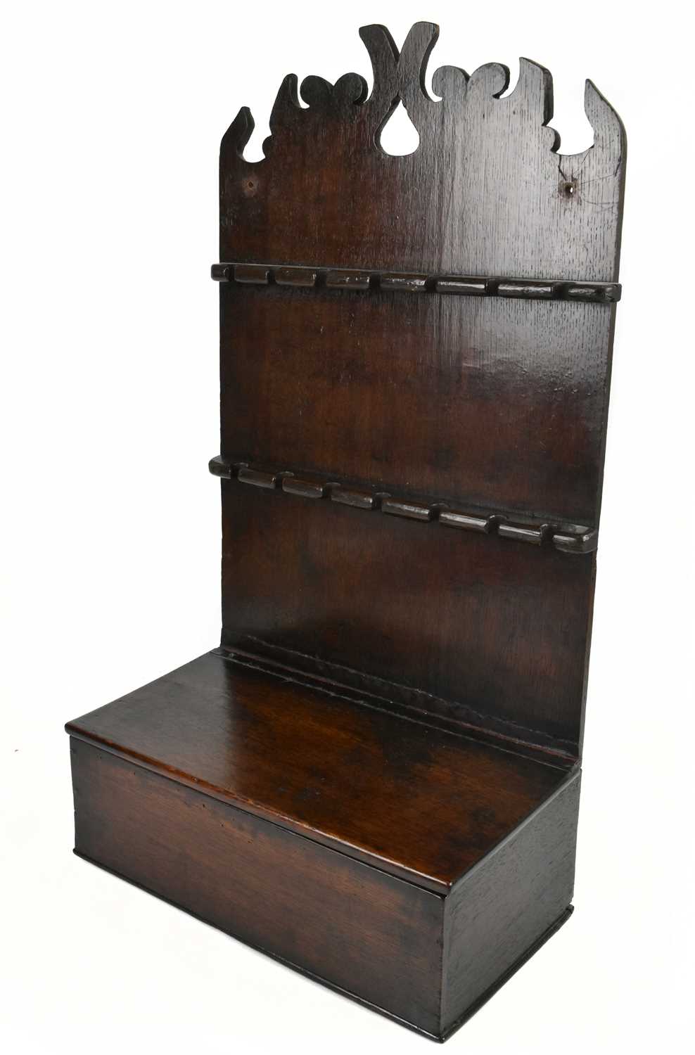 Lot 11 - A Georgian oak spoon rack, with two applied