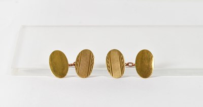 Lot 794 - A pair of 9ct yellow gold oval cufflinks with...