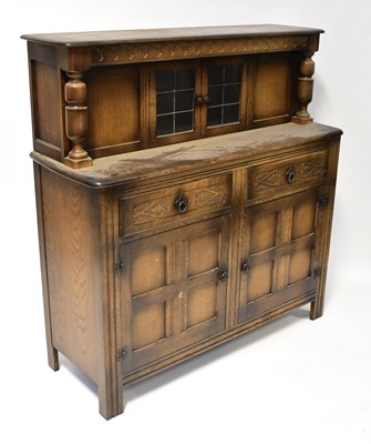 Lot 109 - A Priory-style oak court cupboard, with leaded...