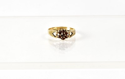 Lot 761 - A 9ct yellow gold cluster ring set with seven...