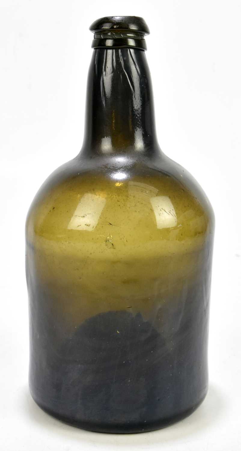Lot 466 An 18th century black glass wine bottle with