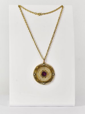 Lot 787 - A yellow metal circular openwork pendant, set...