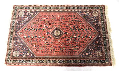 Lot 153 - A terracotta ground hand-knotted rug, with...