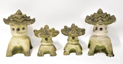 Lot 149 - Three pagoda-style candleholders, together...