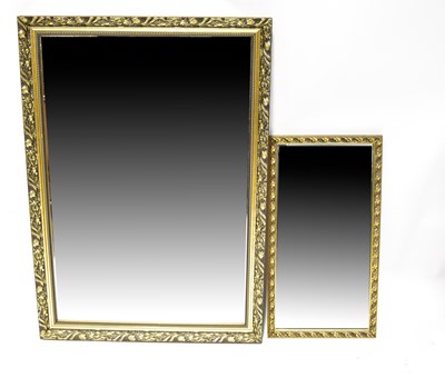 Lot 133 - A rectangular gilt framed wall mirror with...