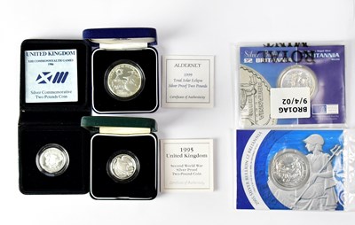 Lot 636 - Five silver coins, comprising three silver...