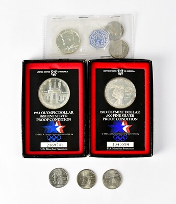 Lot 603 - Two silver proof United States Olympic dollars,...