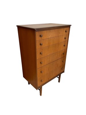 Lot 16 - A mid century teak pillar chest of six drawers,...