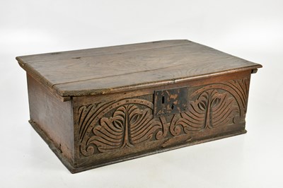 Lot 99 - An 18th century oak bible box with carved...