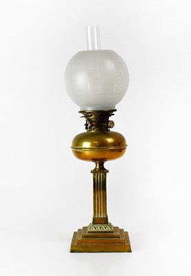 Lot 165 - A brass oil lamp with etched glass shade, on a...