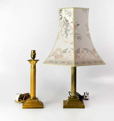 Lot 171 - Two brass table lamps, each in the form of...