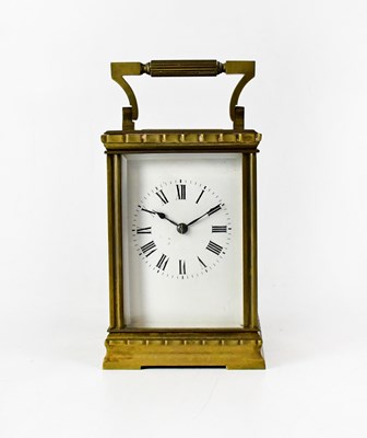 Lot 184 - A brass-cased carriage clock, the enamel dial...