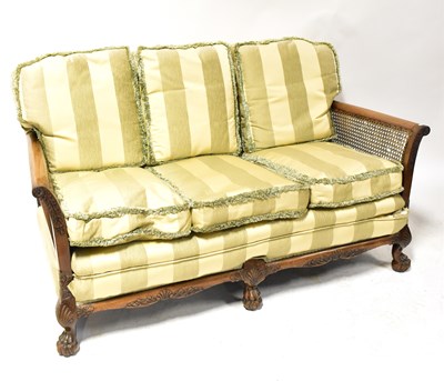 Lot 54 - A 1930s walnut bergère three-piece suite,...