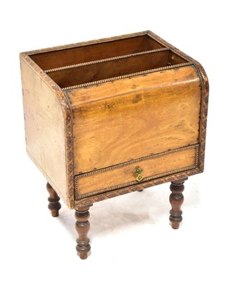 Lot 123 - A 1930s walnut Canterbury, with two sections...