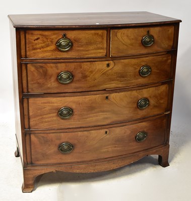 Lot 70 - A George III mahogany bow-fronted chest of two...