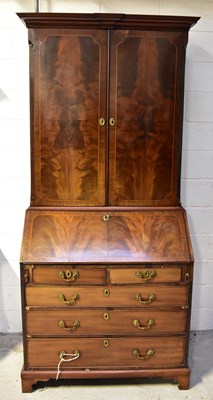 Lot 115 - A George III mahogany bureau bookcase, the top...