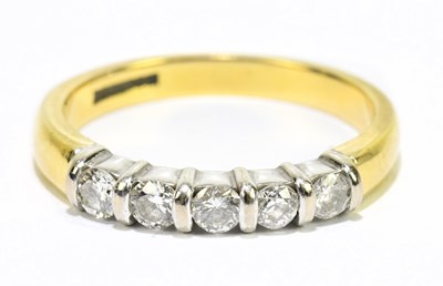 Lot 1111 - A yellow metal and diamond five stone ring,...