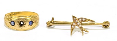 Lot 1206 - An 18ct yellow gold and sapphire twin stone...