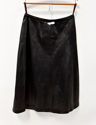 Lot 367 - A black suede A-line mid-length skirt, a Beged-...