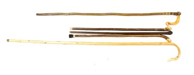 Lot 331 - Three walking sticks and two shepherd's crooks...