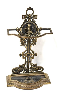 Lot 129 - A cast metal stick stand with cherubic panel...