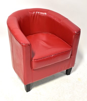 Lot 32 - A contemporary red leather tub chair, raise on...