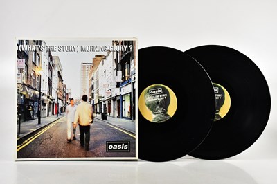 Lot 1076 - OASIS; two albums comprising (What's The...