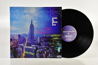 Lot 1076 - OASIS; two albums comprising (What's The...